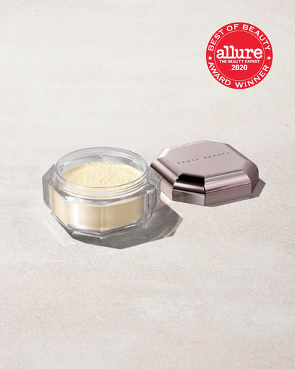 Open container of Pro Filt'r Instant Retouch Setting Powder in shade butter on a concrete background. Allure best of beauty award winner 2020 badge on the top right.