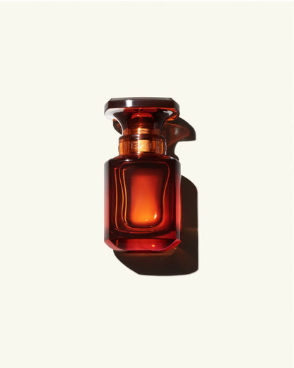 30ml Bottle of Fenty Eau de Parfumon a cream colored background.